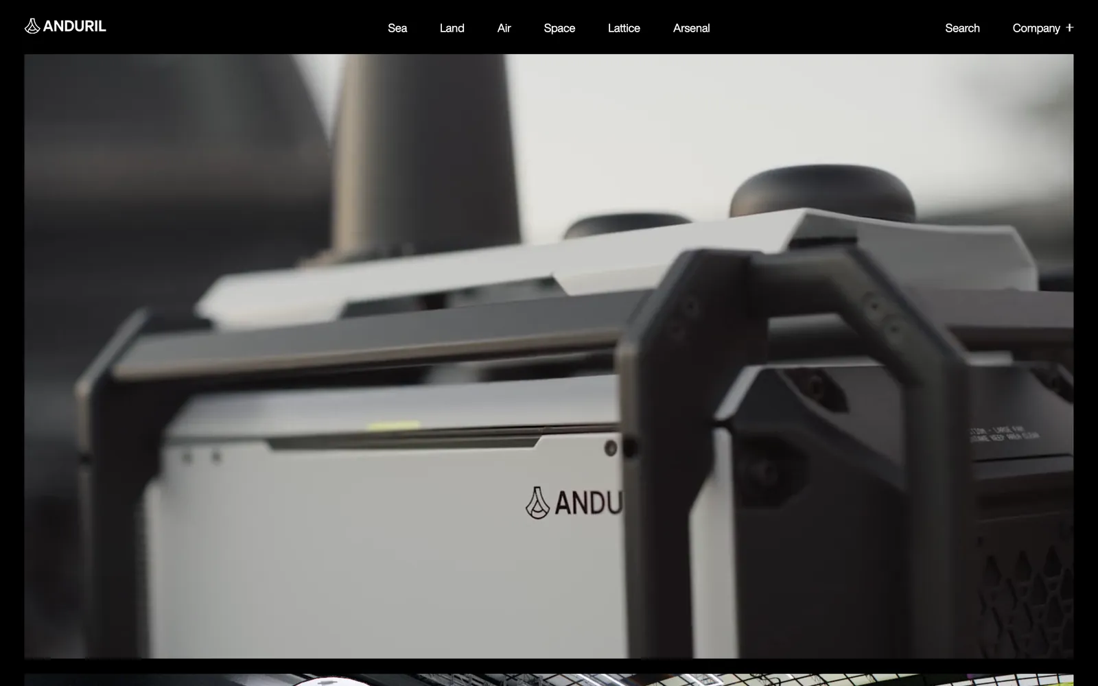 The Anduril homepage: a dark close-up of an Anduril product in a wide film frame, under a menu of Sea, Land, Air, Space, Lattice and Arsenal.