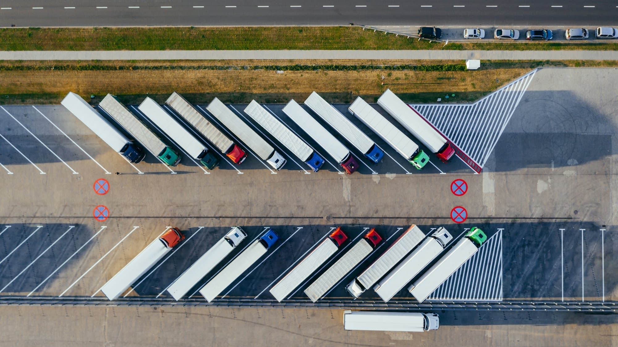 Articulated trailers parked in rows, seen from the air